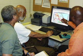 Image of Technicians Looking at IBS Software