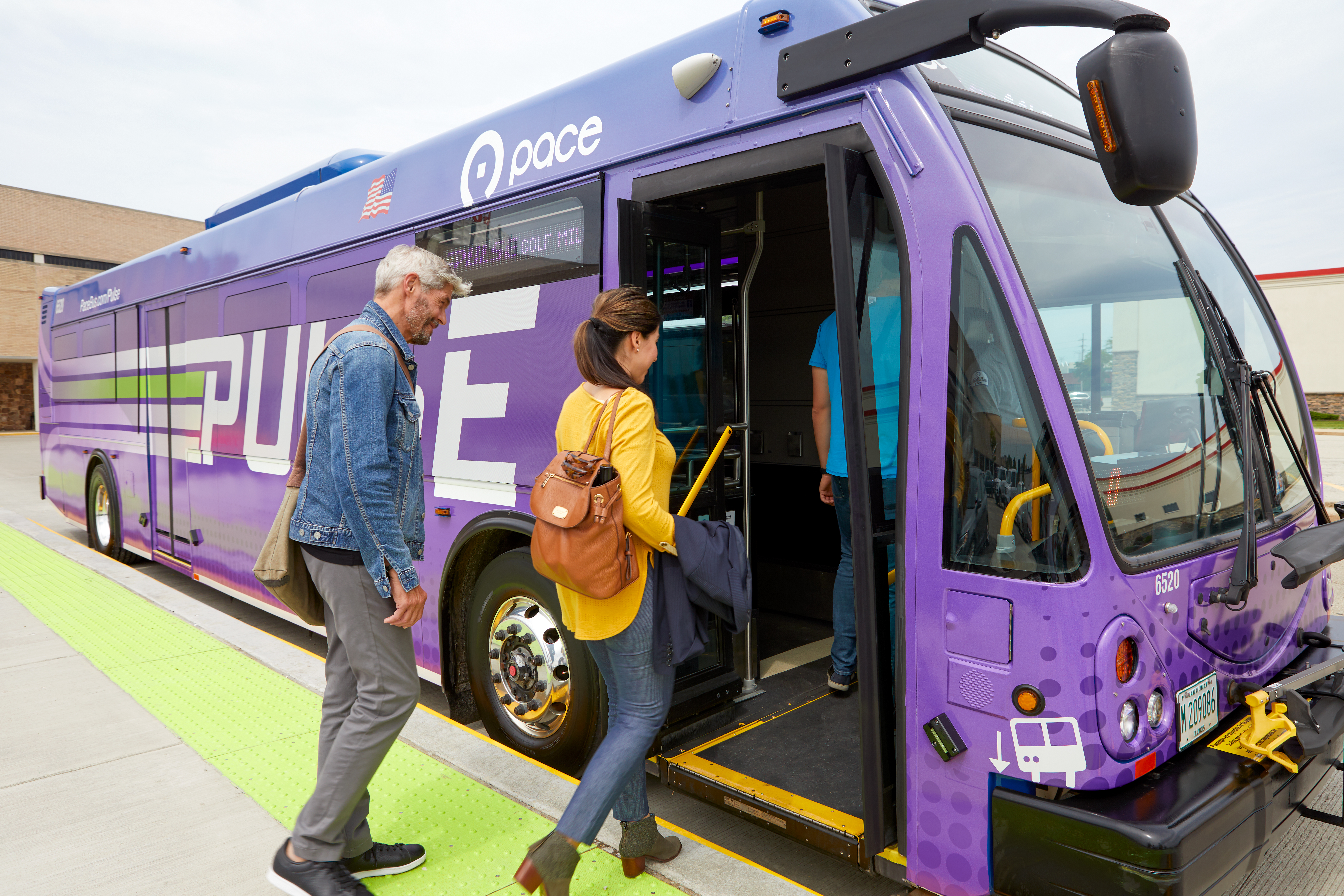 riders boarding Pulse bus