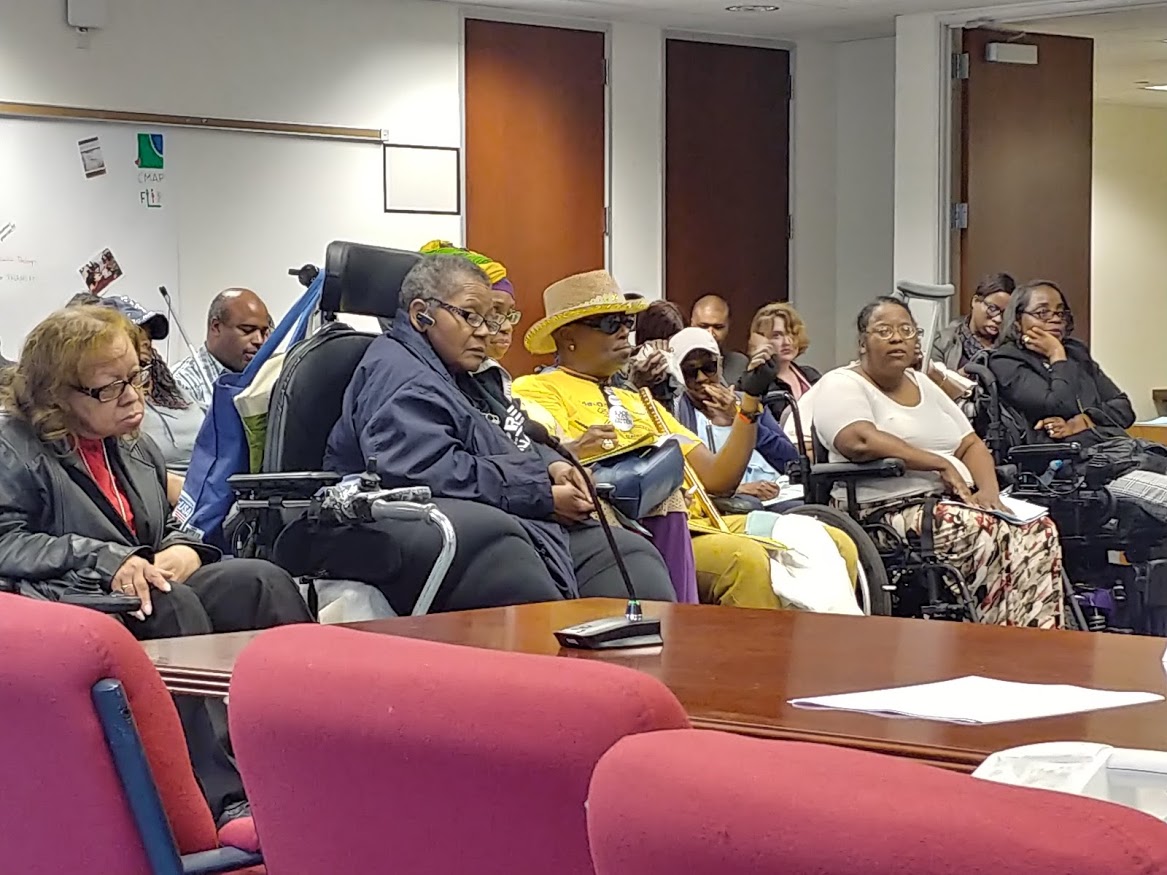 Audience members at an ADA Advisory Committee meeting