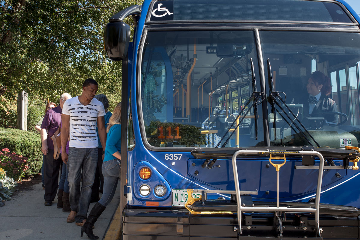 Riders boarding a fixed route bus