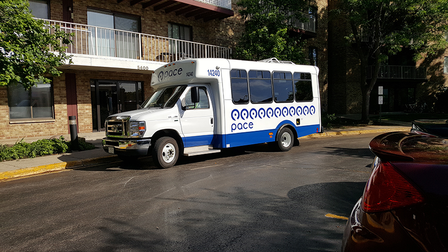 dial-a-ride vehicle at suburban apartment building