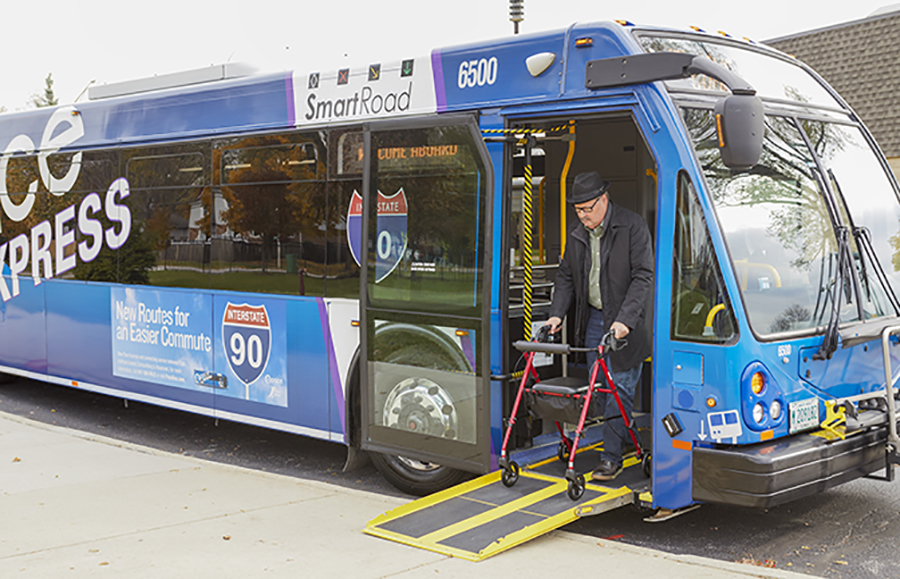 man with walker exiting fixed route