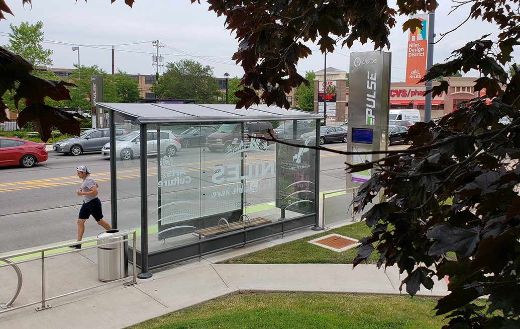 Image of Pulse bus station with jogger running by