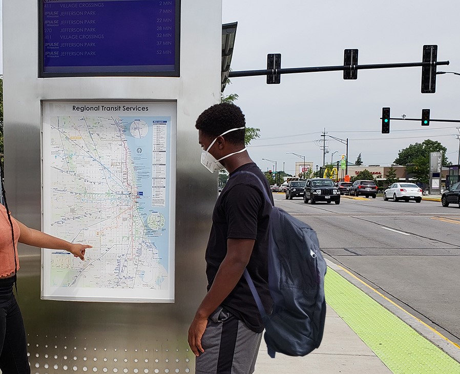 student at pulse station looking at vertical marker map