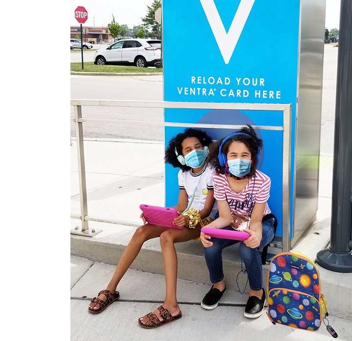 Image of 2 girls at a Ventra vending machine