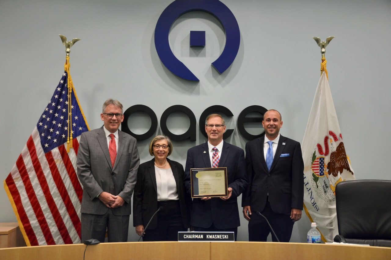 Image showing Pace Executive Director Rocky Donahue, General Manager and Chief Operating Officer Melinda Metzger, Chairman Rick Kwasneski, and Non-Revenue Fleet Administrator Michael Braband pose with Pace’s 2021 National Association of Fleet Administrators (NAFA) Green Fleet Award.