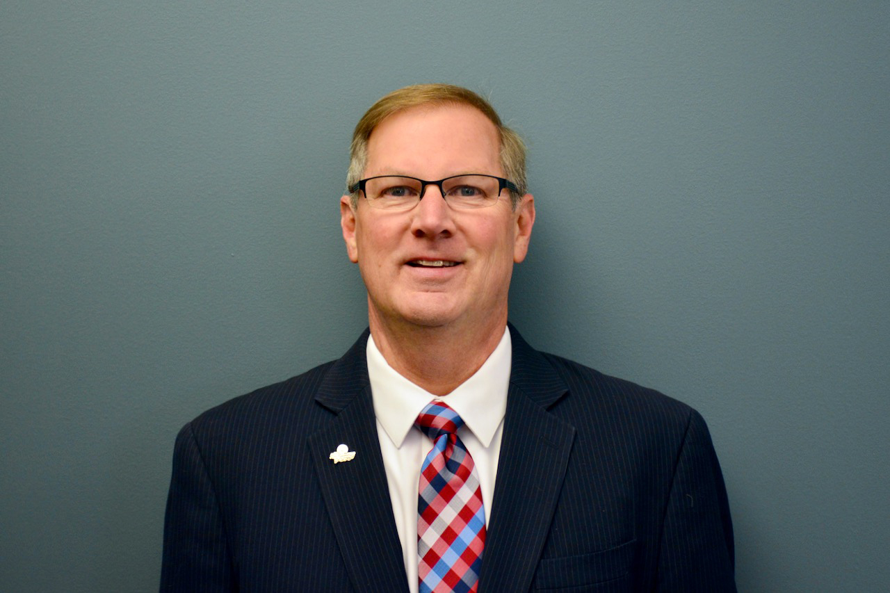headshot of Chairman Rick Kwasneski wearing coat and tie