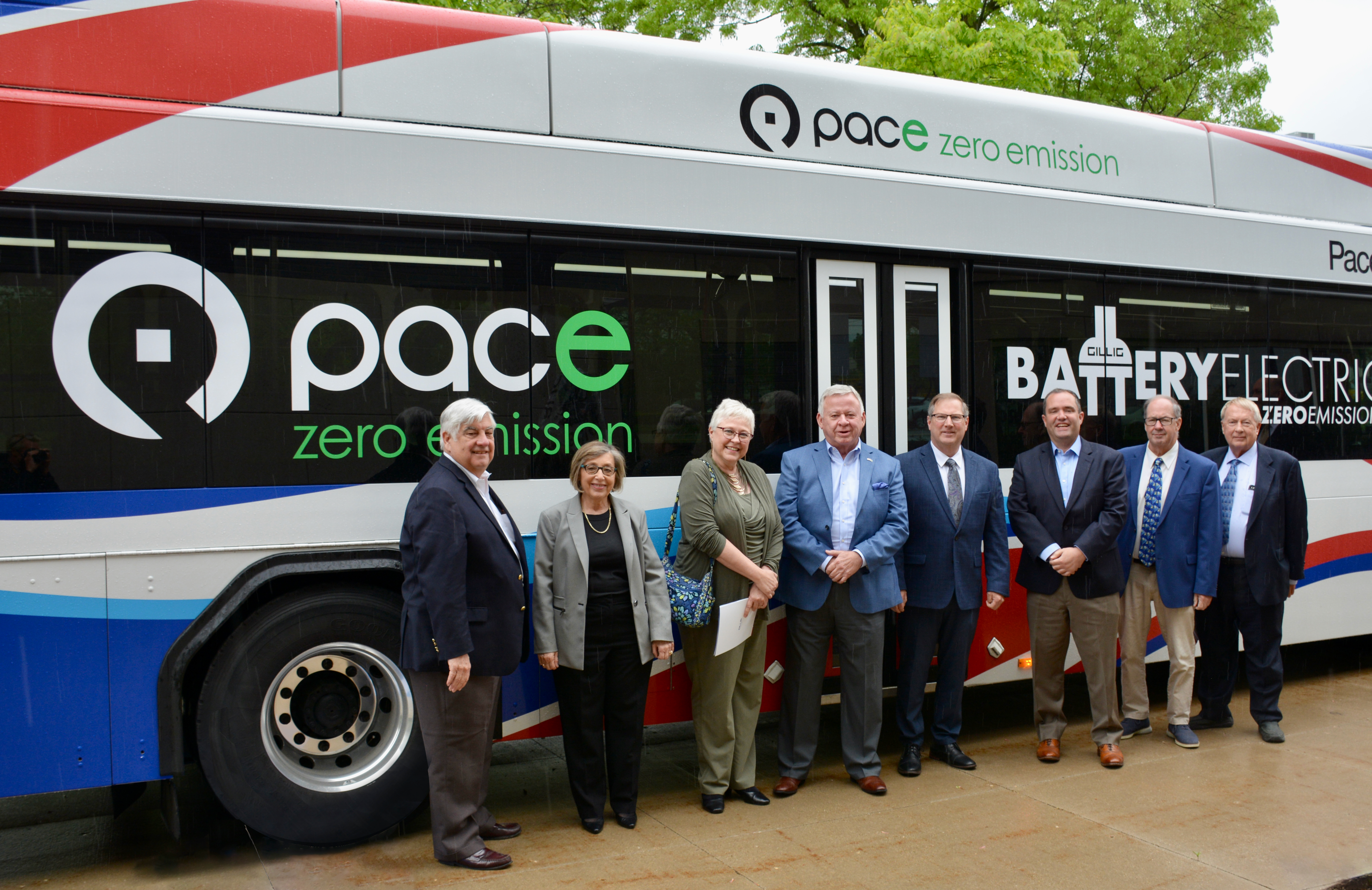 Image showing Pace Board and Executive Director stand in front of a new Electric Bus
