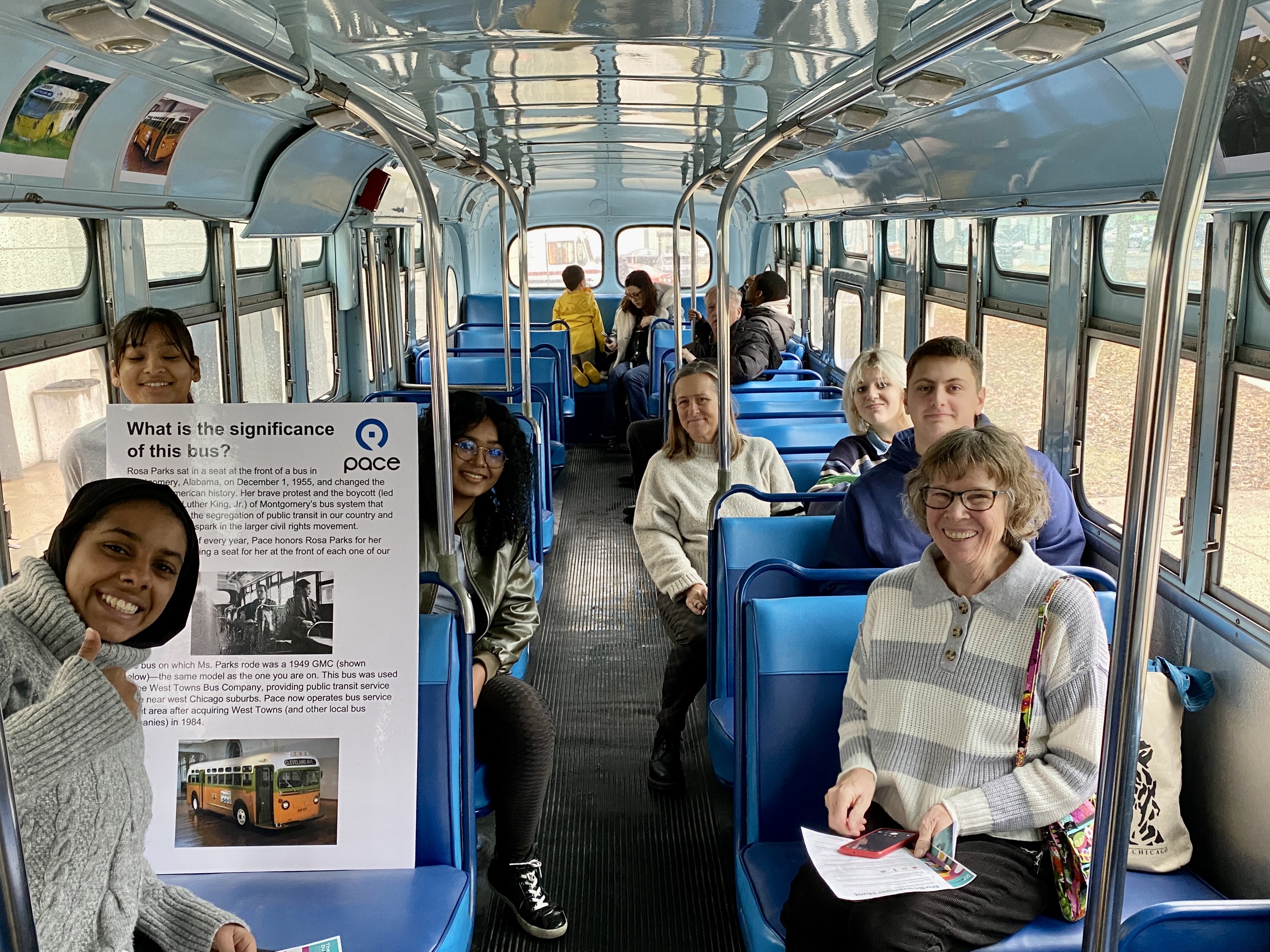 A group of museum visitors aboard Pace's vintage bus