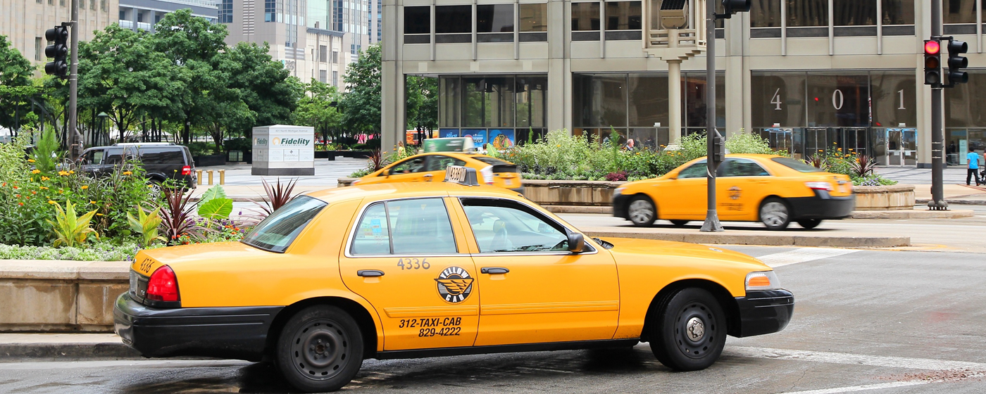 Image of Chicago Downtown showing two taxi cabs