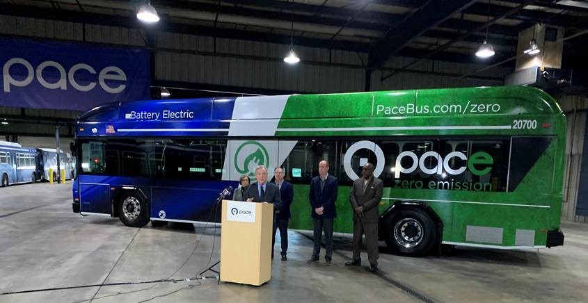 U.S. Congressman Dick Durbin speak at an event celebrating Pace's first electric bus going into service