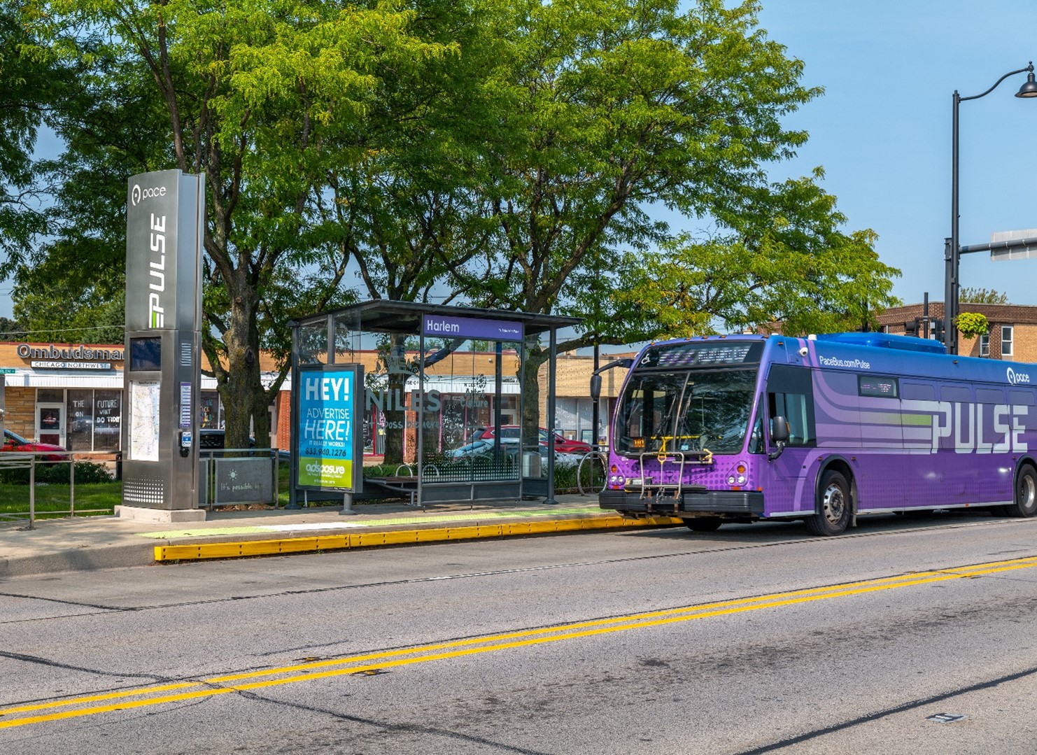 Image of a Pulse Bus on the west side of MIlwaukee Ave. just south of Harlem Ave. in Niles
