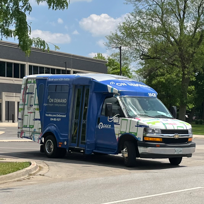 Image of the On Demand vehicle leaving a building
