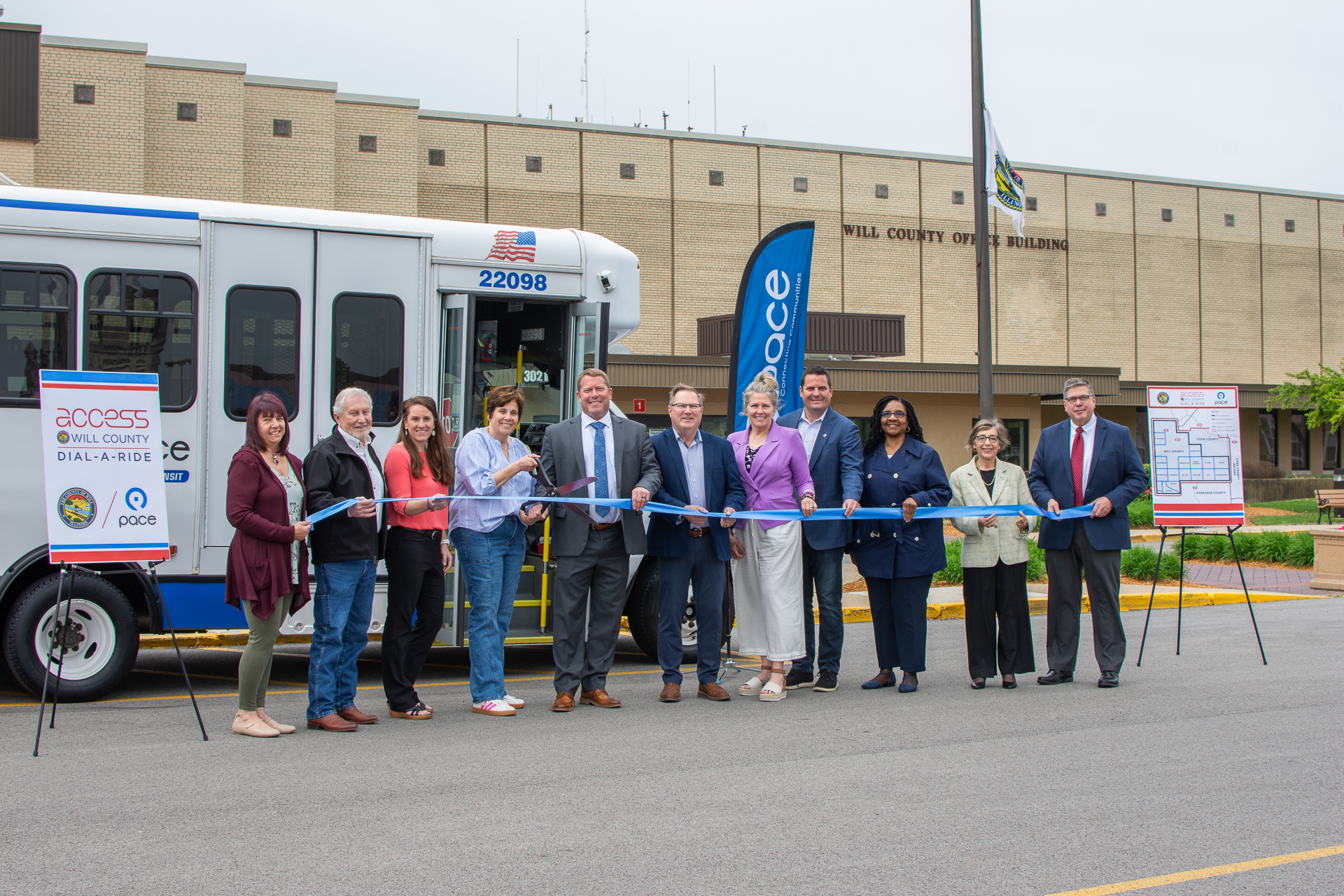 Will County and local officials join Pace representatives to cut a ribbon in front of a Dial-a-Ride bus