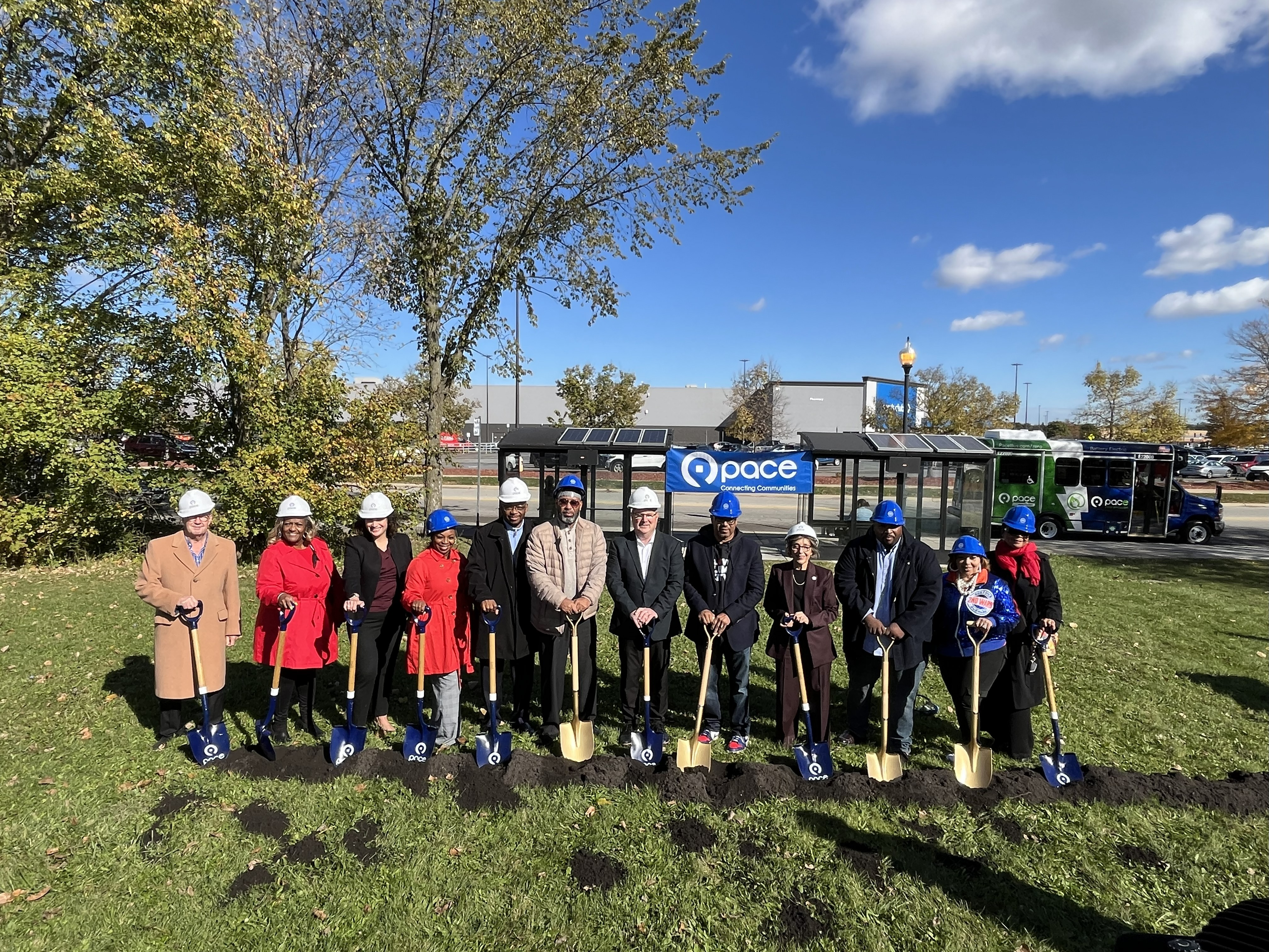 Group with shovels and hard hats breaking ground for the future Calumet City Paratransit Transfer Center