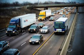 Bus traveling on shoulder of expressway