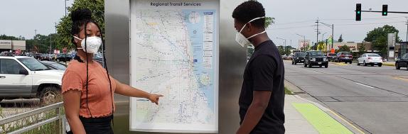 Image of Riders with Masks at Pulse Station