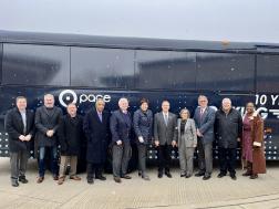 Image showing Officials took a group photo at the 10th anniversary of Pace’s Bus on Shoulder service celebration event