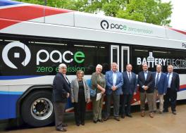 Image showing Pace Board and Executive Director stand in front of a new Electric Bus