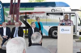 Image of Pace ADA Suburban Advisory Committee Chairperson Jemal Powell speaking at podium